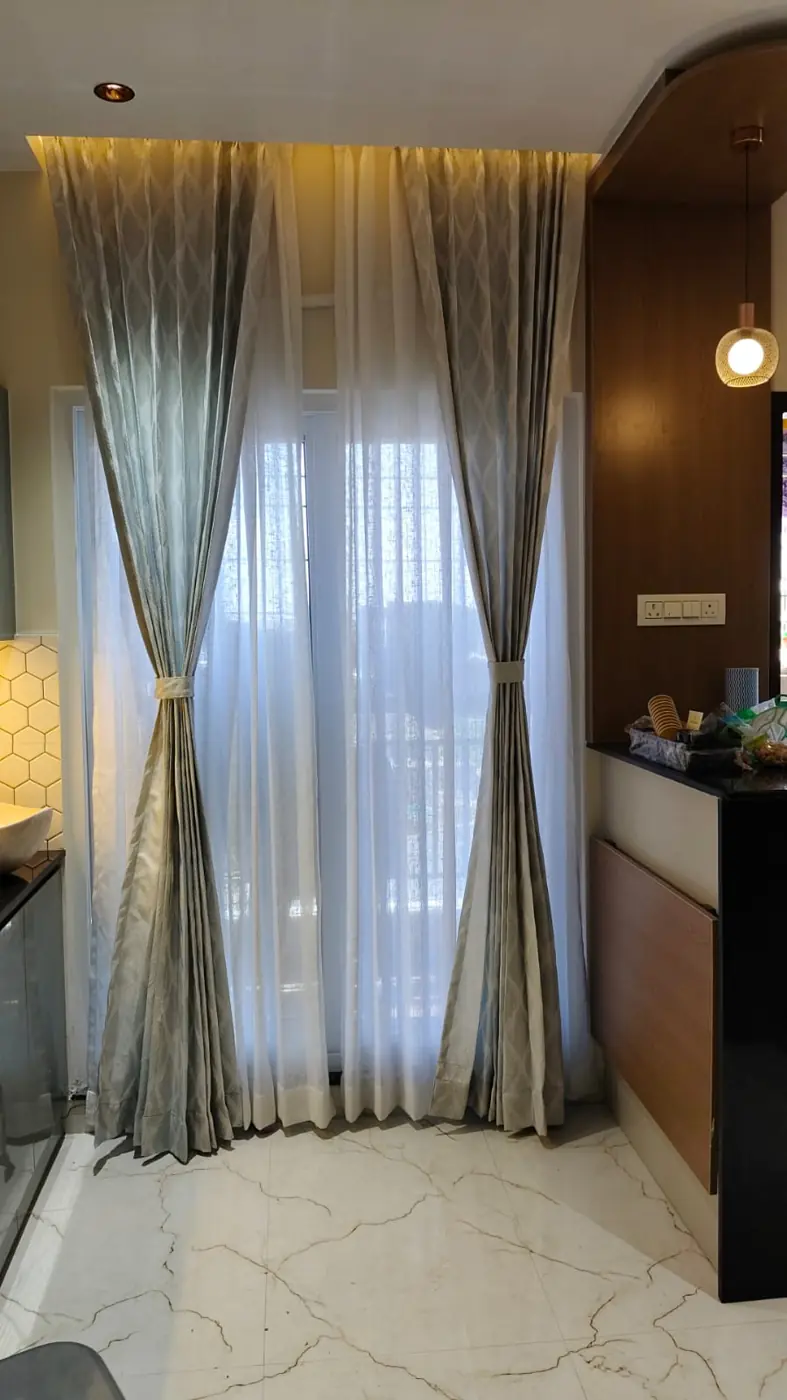 Sheer and drape curtains on a full-height window
